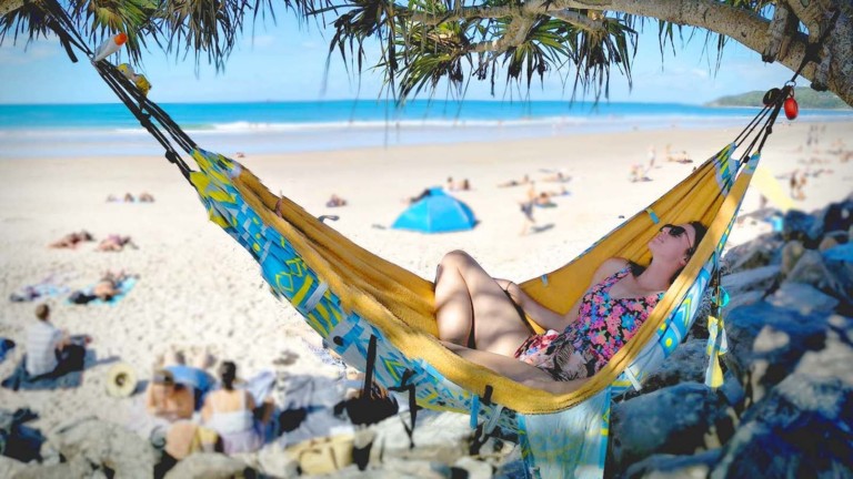 This travel accessory is a hammock, bag, & towel in one