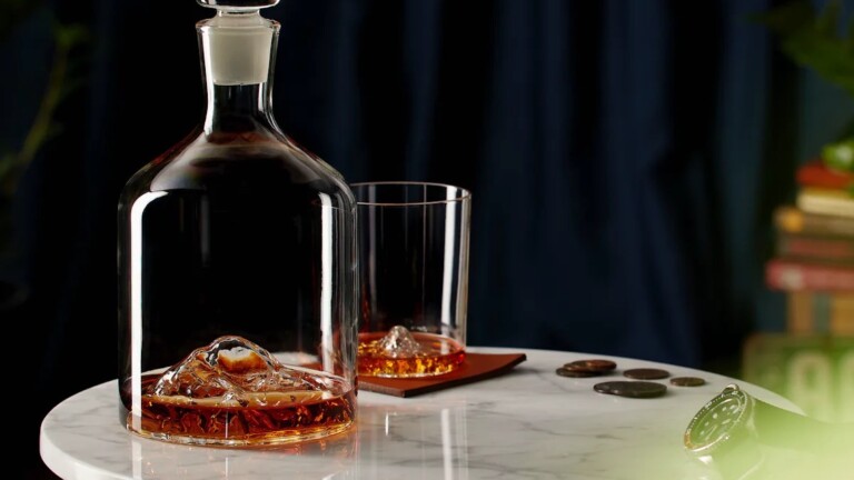 Whiskey Peaks Mountain Decanter features lead-free handblown glass and a 44-oz capacity